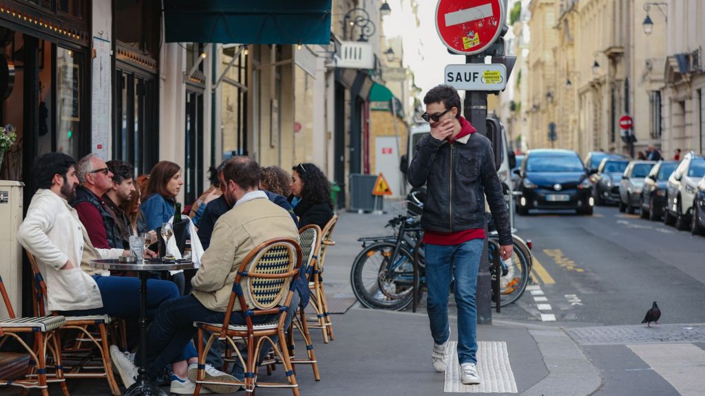 street life in paris with outdoor cafe