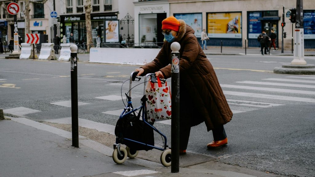 elderly person crossing on the road